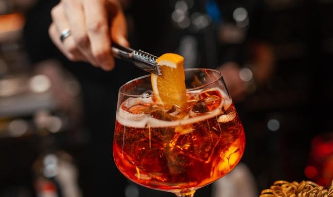 Vibrant community life with a variety of dining options a person pouring a drink into a glass